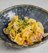 Homemade chicken pelmeni, thyme and ginger cream sauce (270/70 g)