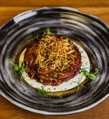 Draniki (potatoes pancakes) with braised beef and mushroom stew (280/30 g)