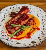 Pork ribs stewed in demiglyas with cherries and olive herbs and pumpkin puree (370 g)