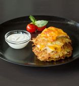Potato pancakes with chicken fillet, baked with Cheddar cheese (200/100 g)