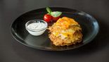 Potato pancakes with chicken fillet, baked with Cheddar cheese (200/100 g)